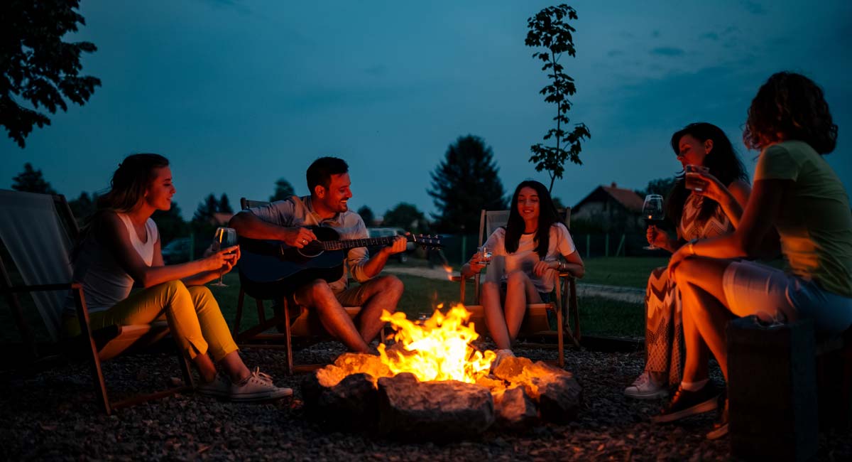 firewood-link-image Firewood Link image with people sitting around a campfire